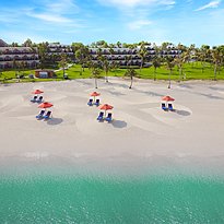 Strand des JA The Resort vor dem Palm Tree Court